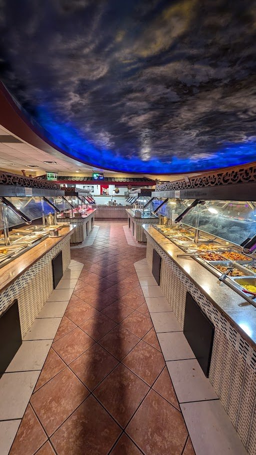 Buffet tables with sushi and hot dishes